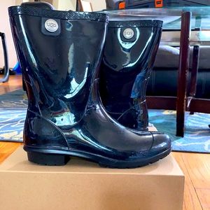 UGG fur lined, black leather rain boots.